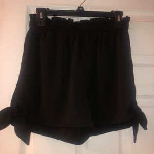 Black shorts with tied ends